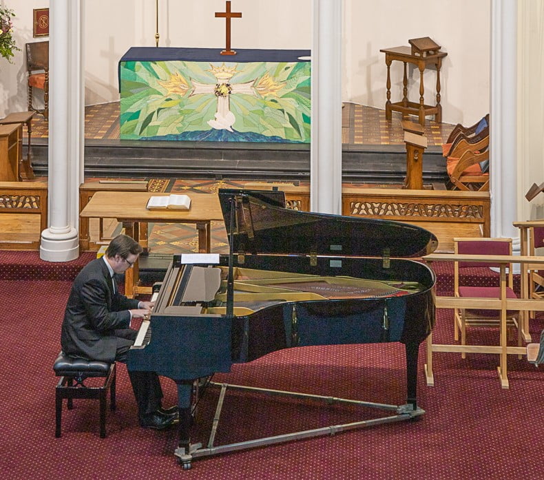 Photograph of James performing, from balony